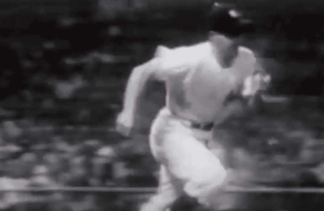 Phil Rizzuto, the Yankees' icon, showcased in a game moment, highlighting his legacy.